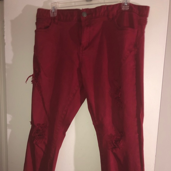 red jeans with holes